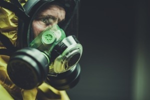 Caucasian Hospital Laboratory Worker in Chemical Lab Mask Fighting Virus Spreading. Closeup Photo. Respiratory Protection.